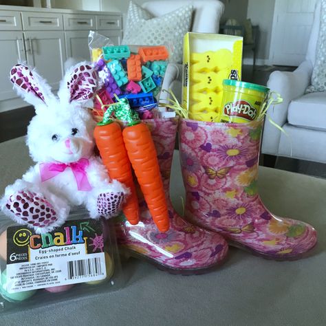 Rain Boots Easter Bucket    Grab some new Rain Boots for your kids and fill them with Easter grass and a few fun items you know they’ll love! I used Peeps, Play-Doh, a Carrot Jump Rope and Building Blocks. I added the Easter Egg Chalk and the little bunny since it wouldn’t all fit in the Rain Boots Rainboot Easter Basket Ideas, Rain Boot Easter Basket Ideas, Rain Boots Easter Basket, Rain Boot Easter Basket, Diy Easter Basket Ideas, Easter Baskets For Kids, Unique Easter Baskets, Creative Easter Baskets, Baskets For Kids