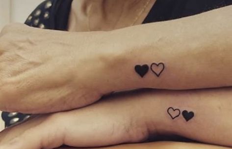 Black And White Heart Tattoo, Black Hearts Tattoo, Two Hearts Linked Together Tattoo, Mini Black Heart Tattoo, Solid Black Heart Tattoo, Black Heart Wrist Tattoo, White Heart Tattoos, Black And White Heart, Couple Tattoos