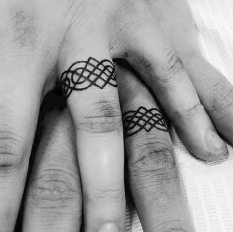 Celtic Wedding Band Tattoo, Wood Rings Tattoo, Ring Finger Tattoo Men, Knot Ring Tattoo, Celtic Ring Tattoo, Couple Ring Finger Tattoos, Wedding Ring Tattoo Ideas, Wedding Band Tattoos, Wedding Ring Finger Tattoos