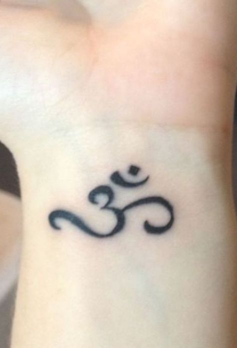 Indian tattoo designs #wristtattoo #mentattoo Ohm Tattoo Women, Om Wrist Tattoo, Ohm Tattoo, Om Tattoo Design, Cool Wrist Tattoos, Om Tattoo, Wrist Tattoos For Guys, Small Meaningful Tattoos, Tattoo Designs For Girls