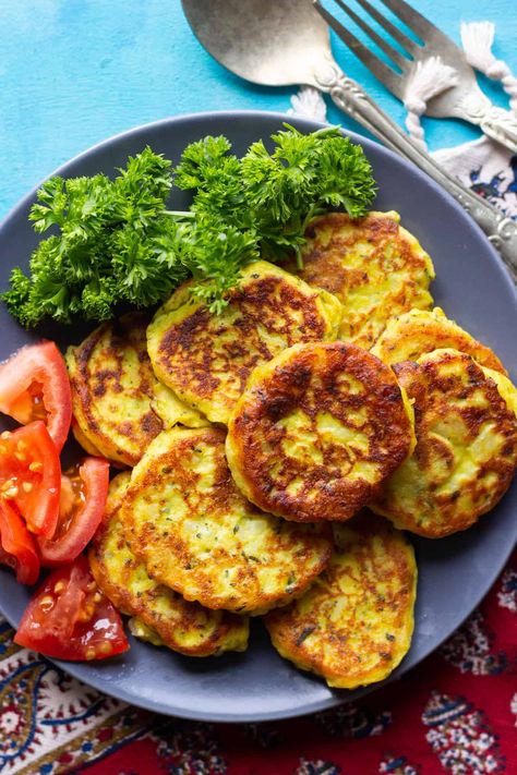 These Persian potato patties are a family favorite. They are so easy to make and you can even use leftover mashed potatoes for the recipe! These potato patties are fried in a little bit of oil until they are crispy and brown on the outside and creamy and soft on the inside. #kuku #potatorecipes #potatopatties #persianrecipes Potato Patties Recipe, Persian Food Iranian Cuisine, Potato Cakes Recipe, Iranian Recipes, Persian Recipes, Iranian Cuisine, Potato Patties, Iftar Recipes, Persian Cuisine