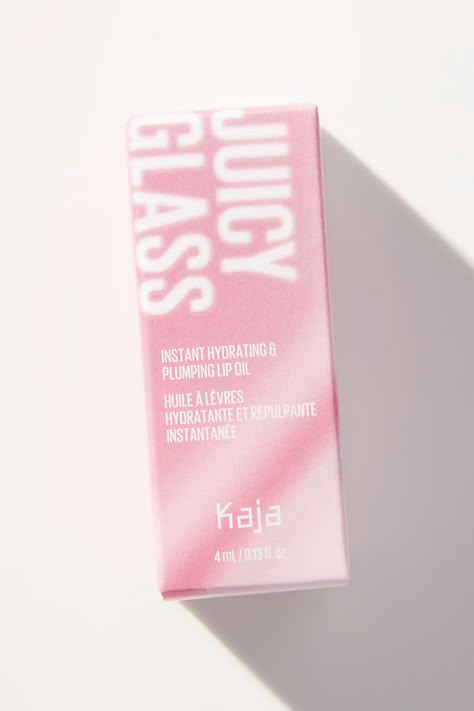 Kaja Beauty Juicy Glass Lip Oils are inspired by fruits and are non-sticky, hydrating and help plump the look of lips. These high-shine glass lip oils are formulated with skin-loving and fruit-infused ingredients that nourish lips. Each individual lip oil has a unique fruity scent and will transform your lips to a stunning juicy pout. | Juicy Glass Lip Oil by Kaja Beauty in Purple at Anthropologie Gen Z Packaging Design, Lip Oil Packaging, Purple Packaging, Makeup Branding, Kaja Beauty, Beautiful Packaging Design, Makeup Packaging, Lip Oils, Luxury Packaging Design