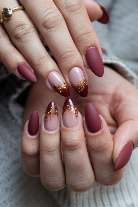 This season, elevate your style with stunning fall nail ideas featuring the elegant Autumn almond shape. Imagine warm shades of burnt orange and deep plum, perfectly shaped into an almond tip that adds sophistication to your look. This design captures the essence of cozy autumn days while offering a chic twist to your nail game. Get inspired to try this stunning blend of color and shape! #FallNailIdeas #AutumnAlmond #NailArt #NailInspo Maroon Accent Nails, Short Almond Thanksgiving Nails, Red Design Nails Almond, Almond Shaped Christmas Nails Simple, Short Almond Shape Nail Ideas, Burgundy Thanksgiving Nails, Fall Color Nails Autumn Gel Designs, Oval Fall Nails Designs, November 2024 Nail Trends