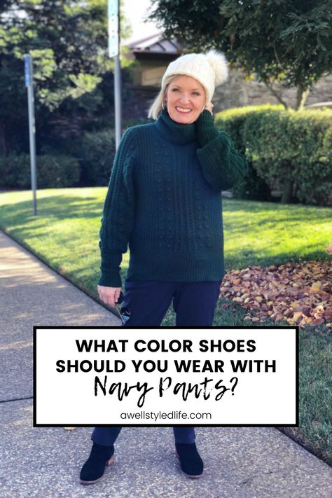 woman wearing navy pants, green turtleneck sweater, black booties and a white hat Shoes With Navy Pants, Shoes To Wear With Navy Pants, Navy Dress Pants Outfit Women, Navy Pants Outfit Women, Navy Pants Outfit Work, Navy Blue Pants Outfit, Navy Pants Outfit, Navy Pants Women, Blue Pants Outfit