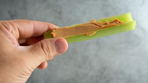 When You Eat Peanut Butter With Celery, This Is What Happens To Your Body - Health Digest Celery And Peanut Butter, Benefits Of Peanut Butter, Peanut Butter Benefits, Steak And Broccoli, Calorie Dense Foods, List Of Foods, Celery Juice, Ate Too Much, Healthy Liver