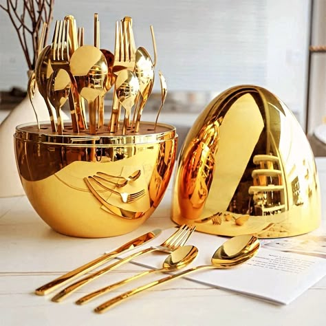 Elevate your dining experience with our Premium Golden Egg-Shaped 24-Piece Cutlery Set. Crafted from mirror-finish stainless steel, each piece brings elegance and sophistication to your table. Perfect for special occasions or everyday luxury! 🍽✨ Price: 2299Rs only . . . Follow us @deedecor_wave . . . For order and inquiries, reach us on WhatsApp at 9266769450 . . . Website: www.deedecorwave.com . . . #LuxuryDining #GoldenCutlery #CutlerySet #StainlessSteel #HomeEssentials #KitchenLuxury #El... Gold Kitchen Utensils, Minimalist Kitchen Essentials, Cookware Set Best, Luxury Cutlery, Dinnerware Set Modern, Gold Kitchen Accessories, Kitchen Decor Collections, Crockery Design, Gold Cutlery Set