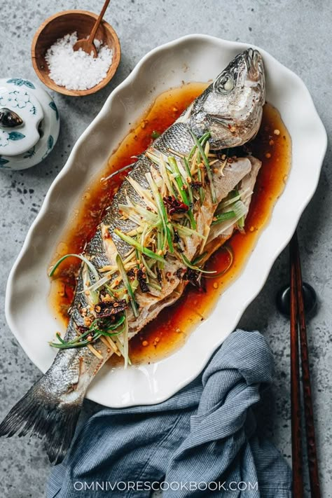 Chinese steamed fish is always a centerpiece on the dinner table at Chinese New Year and other celebratory occasions. Not only is the fish juicy and extra fragrant, it has a stunning appearance and symbolizes good luck. Learn how to make this easy dish in your own kitchen. The method for cooking a fish filet is also included. {Gluten-Free Adaptable} Cantonese Steamed Fish, Steam Fish Recipe Chinese, Asian Fish, Chinese New Year Recipes, Steam Fish, Chinese Fish, Fish Plating, Chinese Fish Recipe, Chinese Steamed Fish