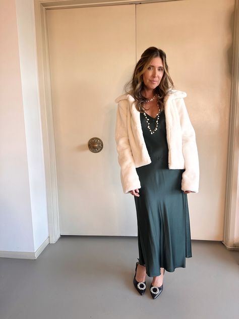 How to style a slip dress for the holidays, style a slip dress for cold weather, wearing a slip dress in winter, melissa meyers, the glow girl, erin Busbee, fashion over 40, Busbee Style Slip Dress Styling, How To Style A Slip Dress, Busbee Style, Tips For Winter, White Faux Fur Jacket, Green Slip Dress, Cold Weather Dresses, Summer Slip Dress, Dress Styling