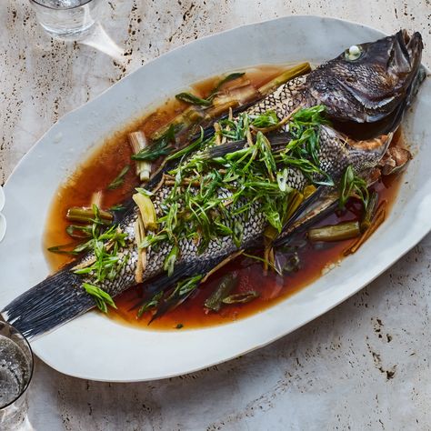 Whole Black Bass with Ginger and Scallions Recipe | Epicurious Bass Recipes, January Recipes, Scallions Recipes, Shrimp Noodles, Mapo Tofu, Black Bass, Crab Rangoon, Steamed Fish, Shellfish Recipes