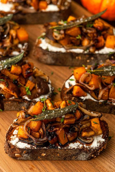 These maple butternut squash crostini include perfectly sautéd mushrooms and shallots, fresh herbs and whipped goat cheese! They also include a divine blackberry balsamic glaze that’s so easy to make and so fun to drizzle! When topped with crispy, salted sage leaves, they make such an enchanting fall appetizer. They’re both sweet and savory, they can be served hot or cold, and they take only about an hour to make! Sautéd Mushrooms, Squash Crostini, Recipes For Dinner Party, Maple Butternut Squash, October Dinner, Halloween Dinner Party Food, Blackberry Balsamic, Fairytale Food, Appetizer Party