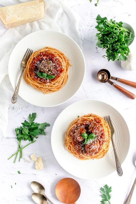 A close up of a serving spoon holding a meatball just above a serving bowl of spaghetti and meatballs. Spaghetti Plating Ideas, Spaghetti Plating Presentation, Spaghetti Plating, Meatball Photography Food Styling, Meatballs With Sausage, Plating Food Presentation, Meatball Photography, Spaghetti And Meatball Dinner Party, Wedding Plating