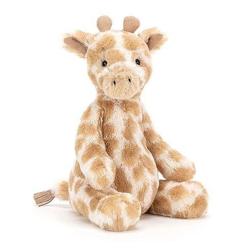 Introducing 'Puffles Giraffe' by Jellycat. Puffles Giraffe is so baby-friendly, in gentle patches of cream and caramel. A gorgeous gift for little ones, this tubby giraffe has soft, squashy horns and a tufty suedey tail. With sweet foldy ears and a butterscotch muzzle, this leaf-munching lovely is a veggie legend! Giraffe Soft Toy, Baby Toy Storage, Gambar One Direction, Jellycat Stuffed Animals, Cute Stuffed Animals, Toy Storage, 귀여운 동물, Soft Toy, Polar Bear