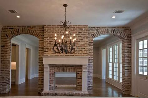 Can you imagine having this view from your kitchen?  I know one happy couple that does.  On the other side of the fireplace is the living room.  I love this two-way fireplace!       Of course they selected a farmhouse sink similar to mine. Good choice!!  The island is painted a gray to … Brick Patterns For Fireplace, Brick Fireplace To The Ceiling, Elegant Brick Fireplace, Joanna Gaines Brick Fireplace, 2 Sided Fireplace Ideas, Old Chicago Brick Fireplace, Brick House Interior Ideas, Two Sided Fireplace Ideas, 2 Sided Fireplace Living Room