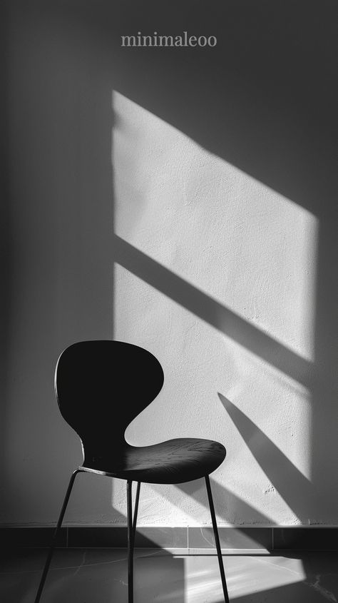 A black chair stands against the background of white walls, with sunlight shining on it from above and casting shadows on its surface. The composition is minimalist, focusing attention to details such as light and shadow play. Black and White photography

#highcontrast #naturallight #globalillumination Casting Shadows, Black And White Chair, Blur Image, Minimalist Black And White, Black Chair, Shadow Play, Black N White, High Contrast, White Photo