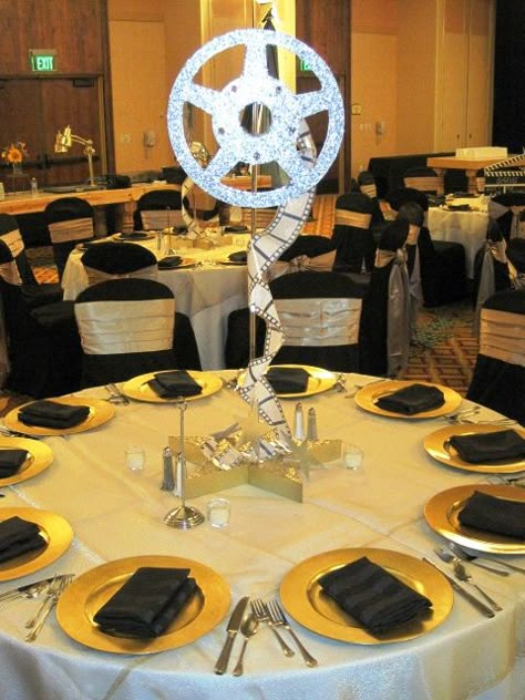 film reel centerpieces | Flickr - Photo Sharing! Diy Film Reel Decoration, Film Reel Centerpiece, Movie Reel Centerpiece, Oscar Theme Centerpieces, Oscars Theme Party Centerpieces, Movie Wedding Centerpieces, Movie Theme Table Decorations, Movie Theme Centerpieces, Hollywood Table Centerpieces