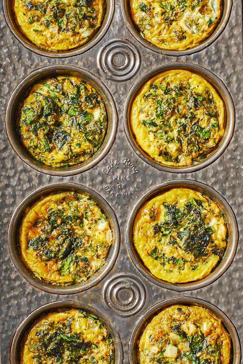 Overhead shot of Spanakopita egg muffins in a muffin tin, showing the herbs and spinach and golden edges. Shrimp Kabob Recipes, Spinach Muffins, Egg Muffins Recipe, Mediterranean Breakfast, Egg Bites Recipe, Healthy Breakfast Recipe, The Mediterranean Dish, Brunch Bread, Spinach Feta