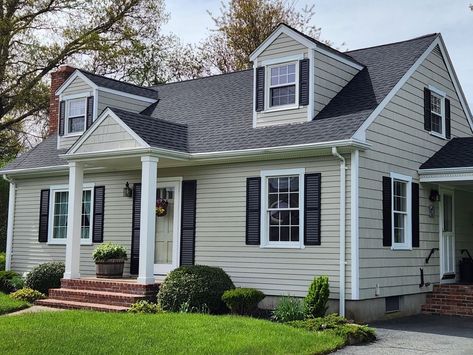 A GAF Timberline HDZ Roofing System in the color Charcoal in Acushnet, MA gives this home a whole new look!  Stylish, durable, and practically priced, a GAF roofing system is a smart investment for all homeowners. Choosing to install a GAF roof adds value and curb appeal to your home thanks to its multi-dimensional look as well as its reliability.  https://carefreehomescompany.com/gaf-roofing-on-cape-cod-style-home-acushnet-ma/  #gaf #roofing #contractor #familybusiness #awardwinning #roofingcontractor #freeroofquotes #acushnetma #southcoastma Curb Appeal Cape Cod House, Cape Cod Grey House Exterior, Cape Cod Exterior Design, Cape Cod Exterior Paint Colors, Modern Cape Cod Exterior, Cape Cod Exterior Remodel, Cape Cod Curb Appeal, Gaf Roofing, Cape Cod Renovation