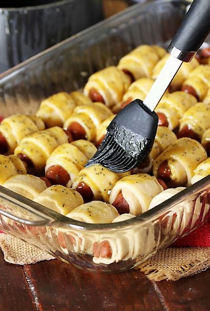 How to Make Glazed Pigs In a Blanket Image Smothered Pigs In A Blanket, Tailgate Pigs In A Blanket, Pigs In A Blanket Football Shape, Pigs In A Blanket With Cheese Recipe, Pig N Blanket Recipe, Pigs In A Blanket Recipe Pillsbury Crescents, Party Pigs In A Blanket, Bbq Pigs In A Blanket, Caramelized Pigs In A Blanket