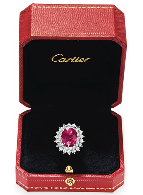 A RUBY AND DIAMOND RING, BY CARTIER. Set with an oval-cut ruby, weighing 11.02 carats, within a two row circular and marquise-cut diamond surround, mounted in platinum, in a Cartier red leather box. Signed Cartier, no. 87416. (partially indistinct) Cartier Ruby Ring, Red Diamond Engagement Ring, Shiny Engagement Rings, Cartier Diamond Rings, Red Diamond Ring, Jewelry Rings Unique, Red Diamonds, Ruby And Diamond Necklace, High Jewelry Ring