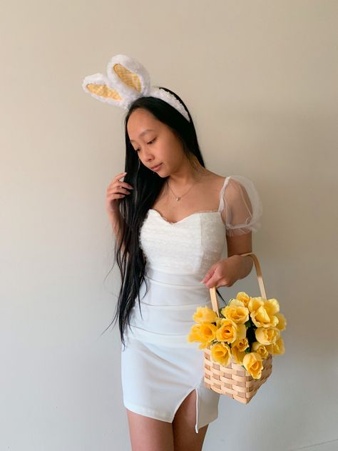 Asian American influencer in white fancy dress holding picnic basket with yellow flowers & bunny ears for Easter photoshoot Easter Poses For Pictures, Easter Picture Ideas Instagram, Easter Costume Women, Easter Photoshoot Ideas Women, Aesthetic Fancy Dress, Easter Poses, Poses With Flowers, Photoshoot Spring, Chick Outfit