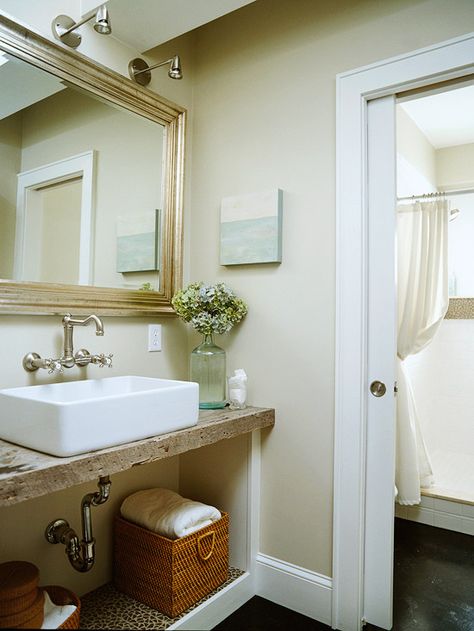 Small Bathroom | A small bathroom with a full shower is another convenient addition to this basement. The old barn wood that serves as the bathroom counter was an inexpensive purchase at a salvage yard. This and other salvaged pieces add character and help connect the lower level to the rest of the house. Beige Bathrooms, Reclaimed Wood Vanity, Beige Bathroom, Cottage Bathroom, Bad Inspiration, Small Bath, Wood Vanity, Bad Design, Basement Bathroom