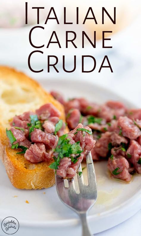 Carne Cruda is a delicious and decadent restaurant quality Italian beef appetizer. Like Steak Tartare this dish revolves around raw beef. Here the finely chopped beef is lightly 'cooked' with lemon juice. Then it is dressed with herbs and extra virgin olive oil and served with crisp ciabatta slices. It makes a small amount of expensive beef go a long way and can be served as part of a charcuterie board or as an appetizer. Fine Dining Starters, Italian Steak, Tartare Recipe, Beef Appetizers, Dinner Party Appetizers, Raw Beef, Beef Tartare, Beef Fillet, Tomato Bruschetta