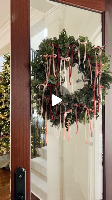 Monica Lavin on Instagram: "Since delicate ribbon bows are having quite the moment this season, I was inspired to make this chic wreath for my front door. I’m also obsessed with this darling velvet ribbon and linked the exact ribbon that I used in my profile. Share to inspire others �✨ #holidaydecor #artoftheentry #wreath #diy" Modern Wreath Bow, Bow Christmas Wreath, Wreath With Ribbon Hanging, 2024 Wreath Trends, Christmas Bow Wreath, Wreaths In Windows Christmas, Velvet Bow Wreath, Velvet Ribbon Wreath, Hanging Wreaths On Windows With Ribbon