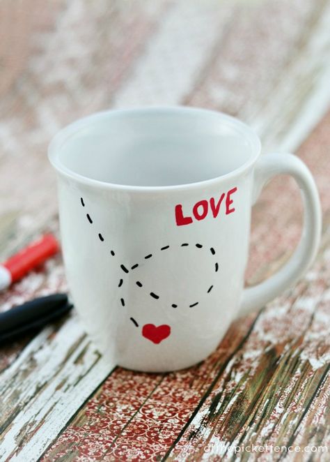 It's so easy during Valentine's Day to get wrapped up in expensive gift giving.  Now don't get me wrong, I love roses and perfume and jewelry as much as the next girl but I also love sweet, simple gifts as well. Like this Love Mug that you can easily make yourself! All you need is an inexpensive mug, paint pens and an oven! [Click Here To Continue Reading...]   If you are reading this post from your email,  we want to let you know that our posts will no contain the option to re... Diy Valentines Gifts For Him, Diy Valentine Gifts For Boyfriend, Diy Valentines Day Gifts For Him, Saint Valentin Diy, Diy Keramik, Valentines Bricolage, Sharpie Crafts, Sharpie Mug