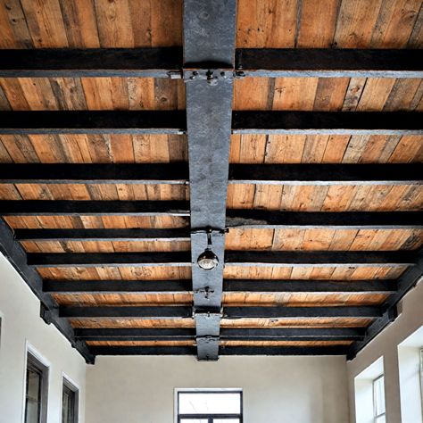 Steel I Beams In House, Suspended Beams Ceilings, Iron Beams Ceiling, Rough Sawn Lumber Ceiling, Exposed Beams In Bathroom, Exposed Beams Basement, Basement Beam Ideas, Exposed Beams Ceiling Lighting, Steel Beams Interior