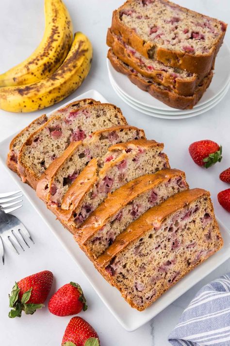 Enjoy the fruity fusion of ripe bananas and fresh strawberries in our strawberry banana bread. Moist, tender, and bursting with sweetness, this easy-to-make treat is perfect for breakfast or a snack any time of day. With a hint of vanilla and a touch of sour cream, each bite is a taste of pure indulgence. Enjoy it on its own or with your favorite spread for a deliciously satisfying treat. Strawberry Banana Bread Recipe, Strawberry Banana Muffins, Sour Cream Banana Bread, Strawberry Banana Bread, Strawberry Muffins, Easy Strawberry, Strawberry Banana, Frozen Strawberries, Ripe Banana