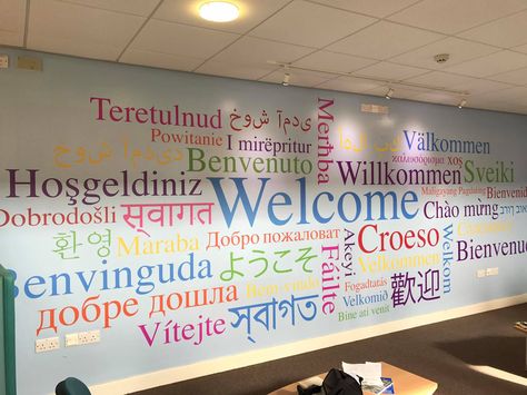 Welcome Different Languages Wall, Language Center Design, Language School Design Interior, Word Mural, School Hallway Decorations, Word Cluster, Immigration Office, Hallway Decorations, School Reception