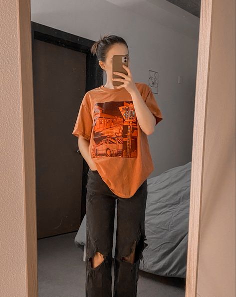 oversized baggy tshirt orange black ripped jeans women’s fashion outfit summer inspo aesthetic OOTD Orange Oversized Shirt Outfit Women, Orange Shirt Outfit Ideas, Orange And Black Outfit Aesthetic, Orange Grunge Outfit, Orange Tshirt Outfits, Pooja Thakur, Baggy Tshirt Outfit, Orange Shirt Outfit, Oversized Tshirt Outfit Jeans