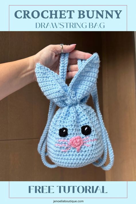 Photo of a hand holding up a blue crochet bunny face drawstring bag. Crochet For Easter, Crochet Easter Basket Pattern, Easter Basket Pattern, Crochet Topper, Bunny Patterns, Crocheted Baskets, Crochet Easter Basket, Purse Patterns Free, Crochet Drawstring