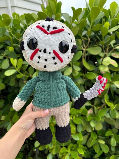 Handmade crochet horror Jason slasher amigurumi Pattern by @donebydonielle Made with Bernat Blanket yarn, safety eyes, and poly-fil stuffing  You will be receiving the exact product pictured  Not recommended for children under 5 Spot clean only *I personally make these crochet items and please note that while I put my full love and effort into them, they are handmade and therefore may have minor imperfections Crochet Jason Voorhees Pattern, Horror Movie Crochet Patterns Free, Crochet Horror Dolls, Horror Movie Crochet, Jason Slasher, Horror Crochet Pattern, Crochet Horror, Horror Crochet, Creepy Stuffed Animals