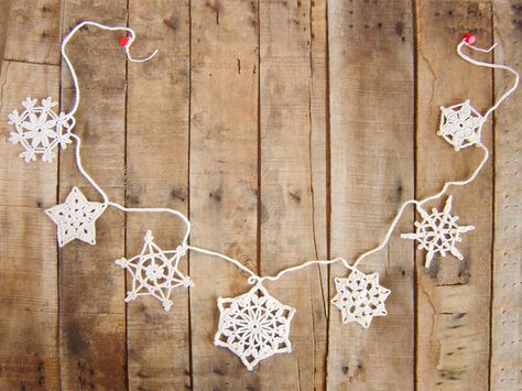 Xmas Garland of crochet ornaments, Xmas tree garland, Christmas decorations handmade ♥ www.etsy.com/shop/UniqueKnitsNadamlada/items ♥ #xmas #christmas #snowflakes #galand #wedding Crochet Snowflake Garland, Crochet Christmas Snowflakes, Crochet Christmas Garland, Snowflake Garland, Christmas Bunting, Fabric Garland, Star Garland, Crochet Ornaments, Crochet Snowflakes