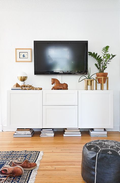 Get interior designer Tasha Schultz's fast and friendly tips for styling your media console with a mix of thrifted and new accessories. How To Style A Media Console, Tv Stand Decor Ideas, Wall Mounted Media Console, Tv Stand Decor, Console Styling, Modern Living Room Decor, Big Tv, Traditional Interior Design, Unique Products Design