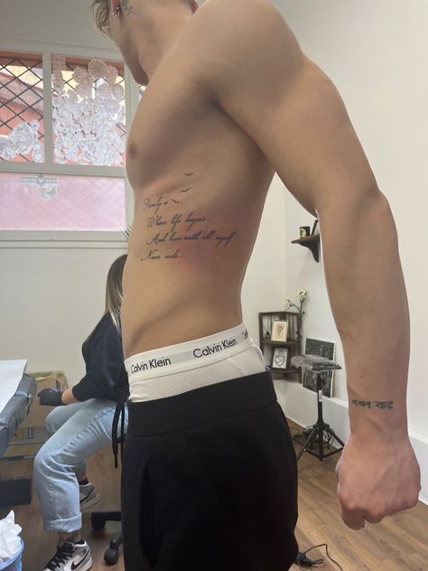 Rib Cage Tattoos For Men Quotes, Rib Writing Tattoo Men, Mens Side Tattoos Ribs, Rib Cage Tattoos For Men, Male Rib Tattoos, Side Tattoos For Men Ribs, Men Rib Tattoo, Men’s Rib Tattoo, Ribs Tattoo Men