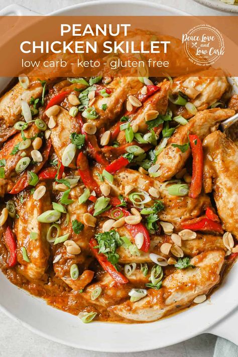 This quick and easy Low Carb Peanut Chicken Skillet recipe is loaded with flavor. Tender, juicy chicken, red bell peppers, and garlic, in a sweet and savory peanut butter sauce, topped with green onions, cilantro, and peanuts. Best of all, this peanut butter chicken only dirties one pan and takes less than 30 minutes. Keto Peanut Chicken Low Carb, Creamy Chicken Peppers, Low Carb Asian Chicken, Low Calorie Asian Chicken Recipes, The Best Keto And Low Carb Recipes, Thai Garlic Pepper Chicken, Keto Peanut Butter Chicken, Healthy Peanut Chicken Recipe, Asian Low Carb Recipes