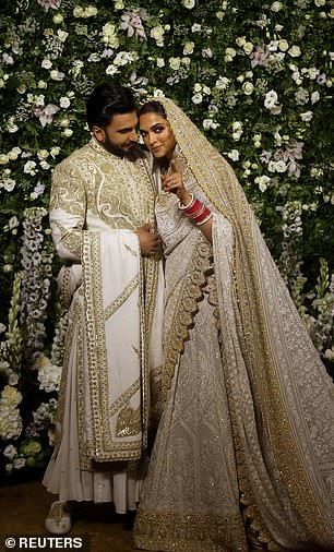 The couple pose for photos during their reception at Mumbai on Wednesday... Deepika Ranveer, Mumbai Wedding, Groom Dress Men, Sherwani For Men Wedding, Nikkah Dress, Wedding Lehenga Designs, Deepika Padukone Style, Wedding Outfit Men, Couple Dress