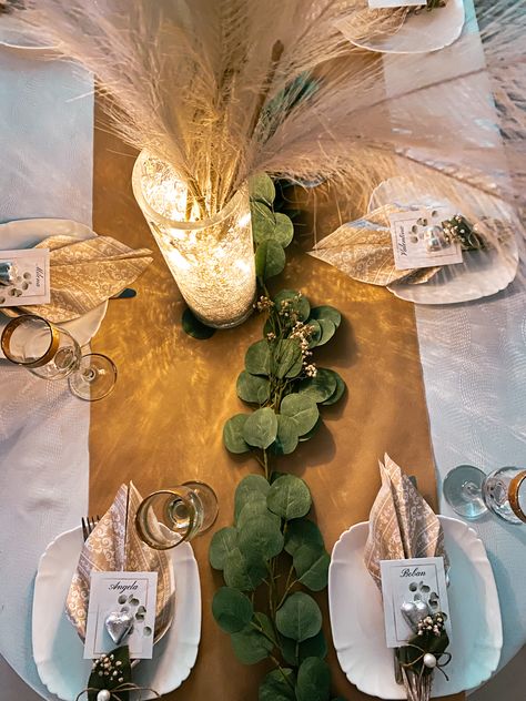 #engagement #decor #engagementdecor #table #beige #cozy #leaves #napkins #nametags #pampas #twinklelights #love #wine #wineglasses Green White Gold Engagement Party, Sage Green And Gold Engagement Party, Green And Gold Engagement Party, Pampas Engagement Decor, Engagement Party Neutral Colors, Engagement Party At Home, Simple Table Decor, White Engagement Party, Faux Pampas