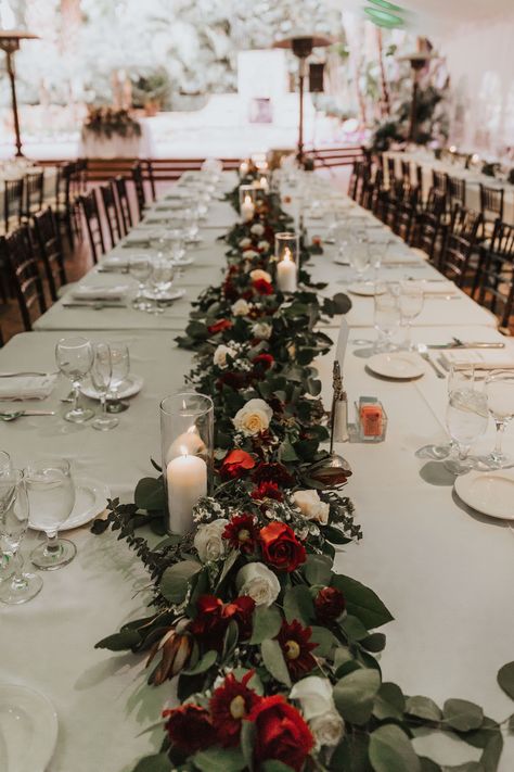 Winter Wedding With Red Accents, Hint Of Red Wedding, Winter Wedding Centerpieces Rectangle Table, Deep Red And White Wedding, Candle Decorations For Wedding, Black White Red Green Wedding, Christmas Arch Wedding, Red And Green Table Decor, Red White Green Floral Centerpieces