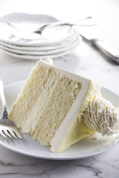 White chocolate cake is elegant, firm and tender, with a fluffy white chocolate mousse filling and a pretty drip ganache design. Lemon Bar Cake, Mousse Cake Filling, White Chocolate Mousse Recipe, Lemon Cake Bars, White Chocolate Mousse Cake, Chocolate Mousse Cake Filling, Amaretto Cake, Raspberry Mousse Cake, Bar Cake