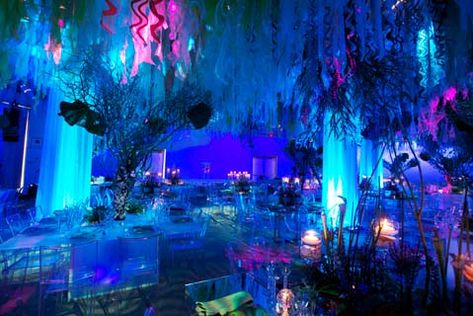 By  hanging flowers from the ceiling of the venue you will create the effect of sea kelp and with colorful blue lighting you can achieve your under the sea theme in a tasteful manner. Prom Themes, Underwater Theme, Sea Wedding, Winter Wonderland Theme, Special Events Decor, Wedding Social, Prom Decor, Prom Theme, Under The Sea Theme