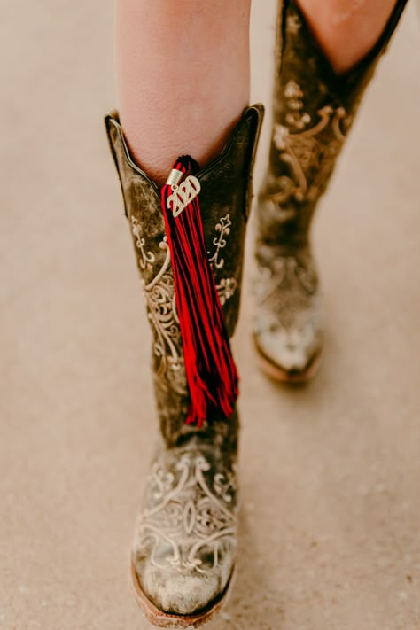 College Graduation Pictures Western, Senior Pictures With Bow And Arrow, Cowboy Graduation Pictures, Western Cap And Gown Pictures, Cowboy Boots Graduation Pictures, Grad Pictures With Horses, Cute Western Senior Pictures, Western Cap And Gown Senior Pictures, Western Graduation Cap Ideas