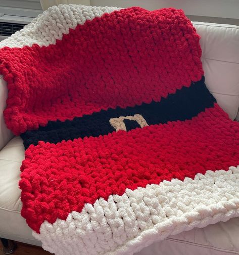 "Chunky knitted Santa blanket  Chunky knitted Christmas blanket  This Christmas Santa blanket is perfect for decor or even a gift! The pictures included are a lap throw size All orders are handmade If there is any personalization you would like to include, please feel free to message me! I will try my best to accommodate you *I do not accept returns or exchanges all sales are final* Please note: Processing time will differ depending on the size of the blanket ESTIMATED PROCESSING TIME Baby:3-5 business days Throw: 4-6 business days Twin: 5-7 business days Full: 6-8 business days Queen: 6-8 business days King: 7-10 business days DIMENSIONS: Baby: 28\" x 28\" Lap throw 30\" x 50\" Standard Throw 40\" x 60\" XL Throw: 50\" x 60\" Twin: 39\" x 75\" Full: 54\" x 75\" Queen: 60\" x 80\" King: 76 Santa Blanket, Crochet Patchwork Blanket, Chunky Blanket Diy, Chunky Blanket Pattern, Chunky Knit Blanket Pattern, Knitted Santa, Chunky Yarn Blanket, Chunky Blankets, Chunky Crochet Blanket Pattern