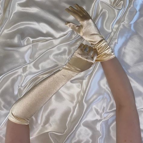 Absolutely stunning and so uniquethis is my brand new designlovely quality stretch satin gloves Perfect for the bride to bea unique giftIdea for weddings and the hen do too Simple and classy Champagne golden colour Royal Mail have been a bit slow lately so these are now posted with 1st classCheck out my page for other colours I have other beautiful gloves on my shopand more designs coming in the near future so favourite my shop to stay up to date These are one sizeplease check mea Heartless Curls, Gloves Aesthetic, Silk Gloves, Satin Gloves, Dress With Gloves, Elegant Gloves, Gold Gloves, Formal Gloves, Golden Colour