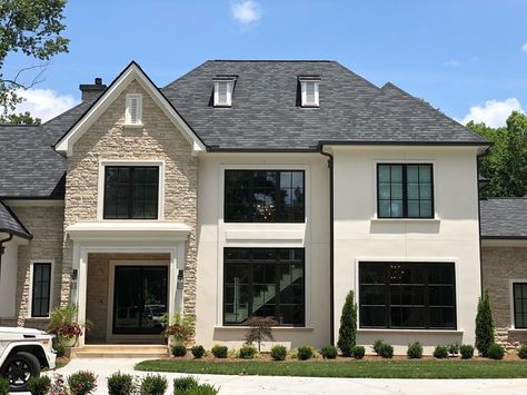 The smooth stucco finish and cut stone on the exterior highlight the homes massing, and the large modern windows welcome you! . . .… Beige Stucco House Exterior, Stone And Stucco House Exterior, Smooth Stucco, Stucco And Stone Exterior, Cypriot Food, Eldorado Stone, Stucco Finishes, Florida House Plans, Brick Houses