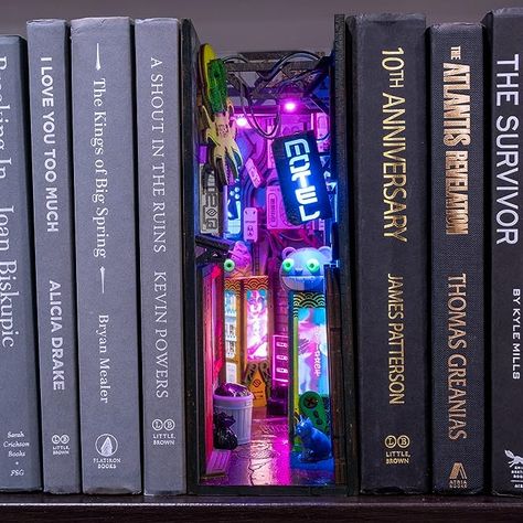 Amazon.com: MINIALLEY Cyberpunk Assembled and Painted Complete Booknook Bookshelf Insert Bookshelf Decor Alley Book Nook… : Home & Kitchen Cyberpunk Book Nook, Cyberpunk Gifts, Futuristic Bookshelf, Cyberpunk Theme Room, Cyberpunk Home Decor, Cyberpunk Furniture, Cyberpunk Bedroom Ideas, Bookshelf Dark Academia, Cyberpunk Alleyway