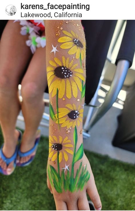 Flower Face Paint On Arm, Cactus Face Paint, 70s Face Paint, Earth Day Face Paint, Leaves Face Paint, Water Face Painting, Summer Face Paint Ideas, Daisy Face Paint, Sunflower Face Paint