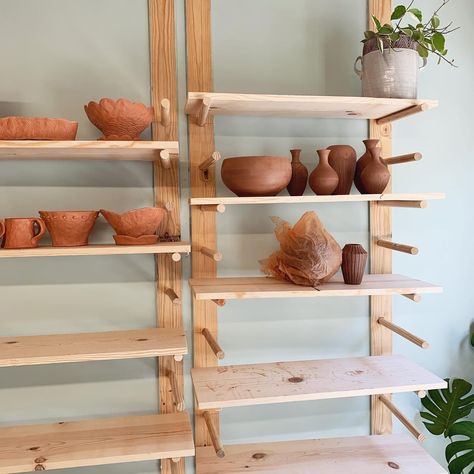 Pottery Studio Shelves, Pottery Studio Shelving, Dowel Shelves, Wooden Peg Board, Pottery Corner, Studio Pics, Tiny Pottery, Office Shelves, Pottery Display